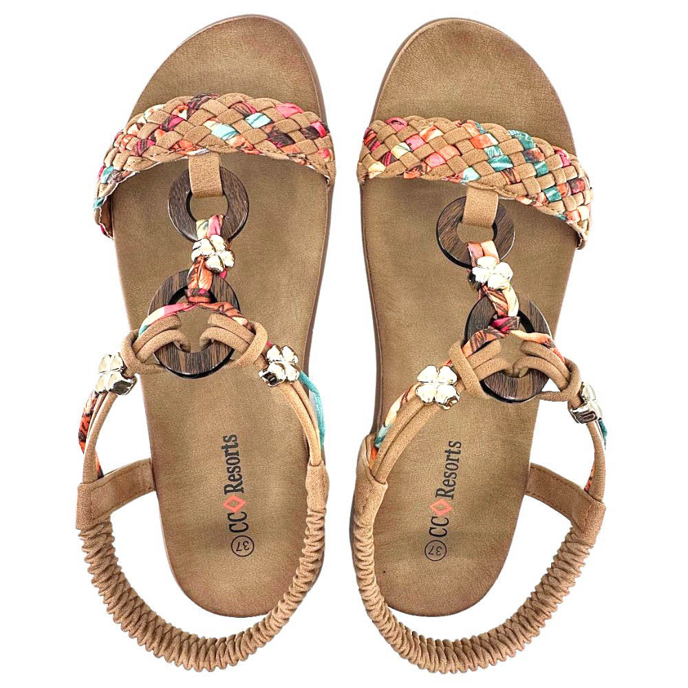 A pair of CC Resorts woven sandals with tan suede footbeds, colorful braided straps, and decorative wooden and fabric accents, shown from a top-down view on a white background.