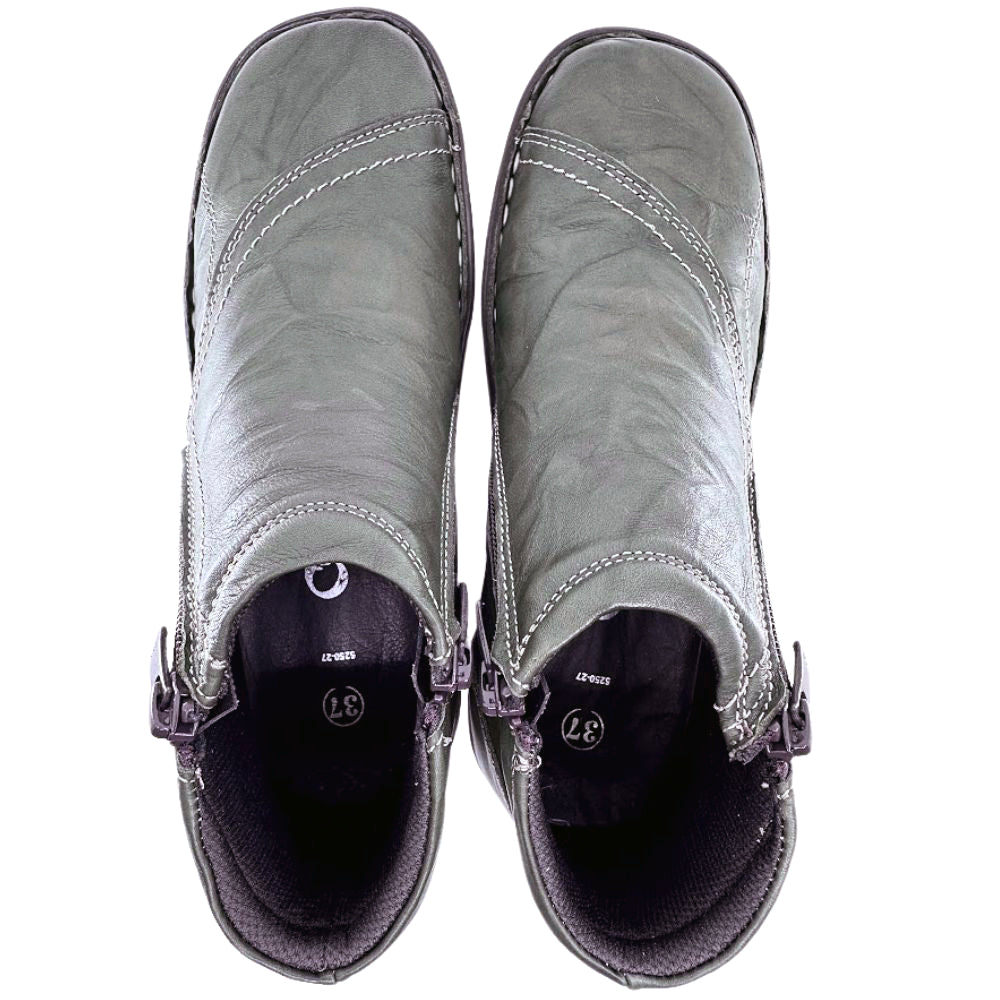 Pair of khaki leather ankle boots on a white background