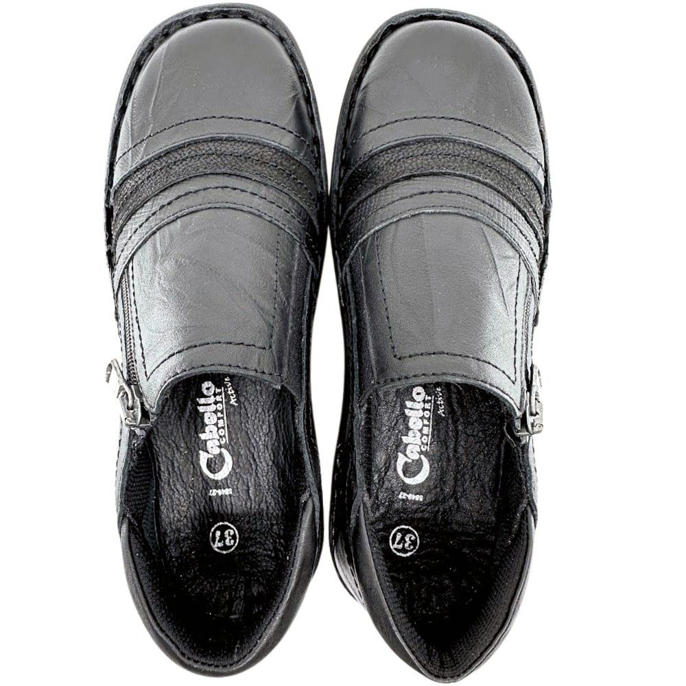 Pair of black slip-on shoes with a visible brand logo on a white background