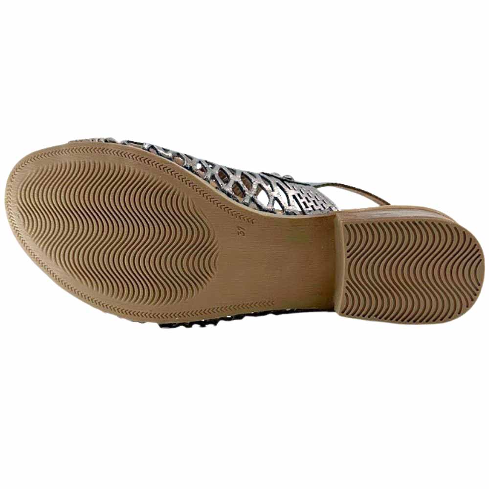 The brown rubber outsole of a Cabello heeled sandal, with a wavy tread pattern, set against a white background.