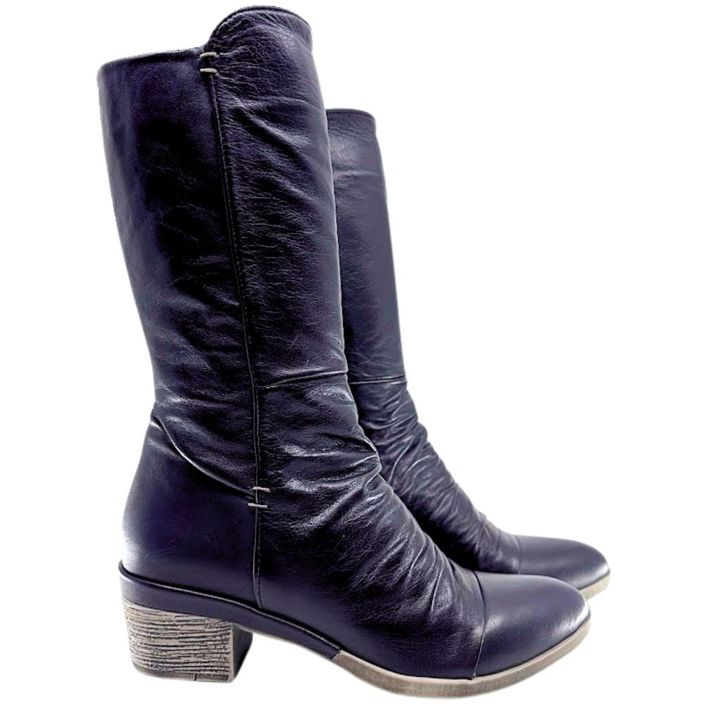 Pair of black knee-high boots on a white background