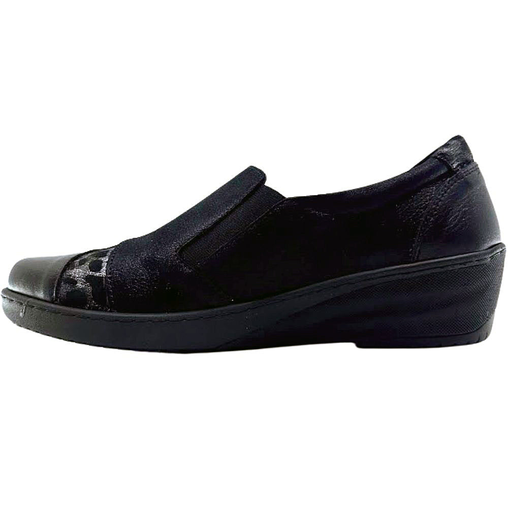 Black slip-on shoe on a white background
