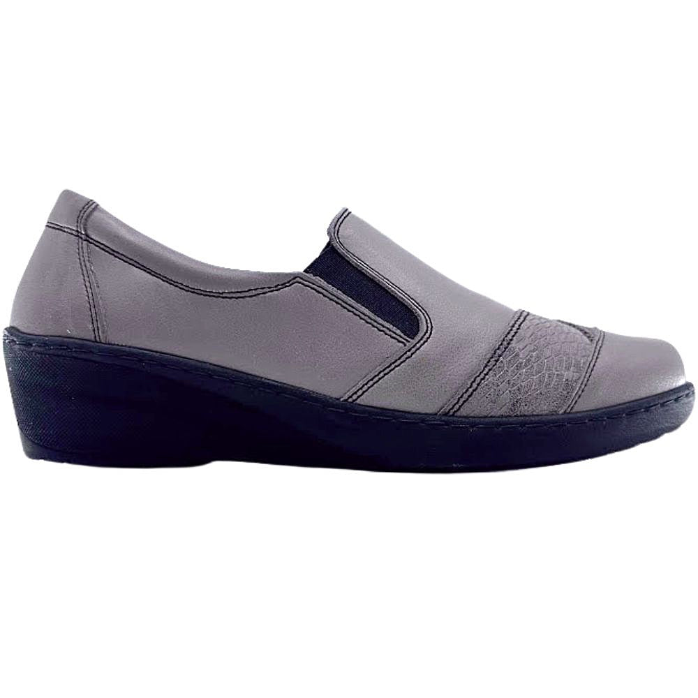 Taupe slip-on shoe with a black sole on a white background