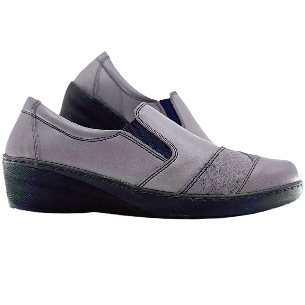 Taupe slip-on shoes with a black sole on a white background