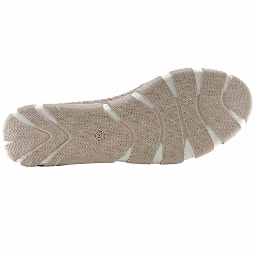 The taupe and white rubber outsole of a Cabello sneaker with a tread pattern, shown against a white background.