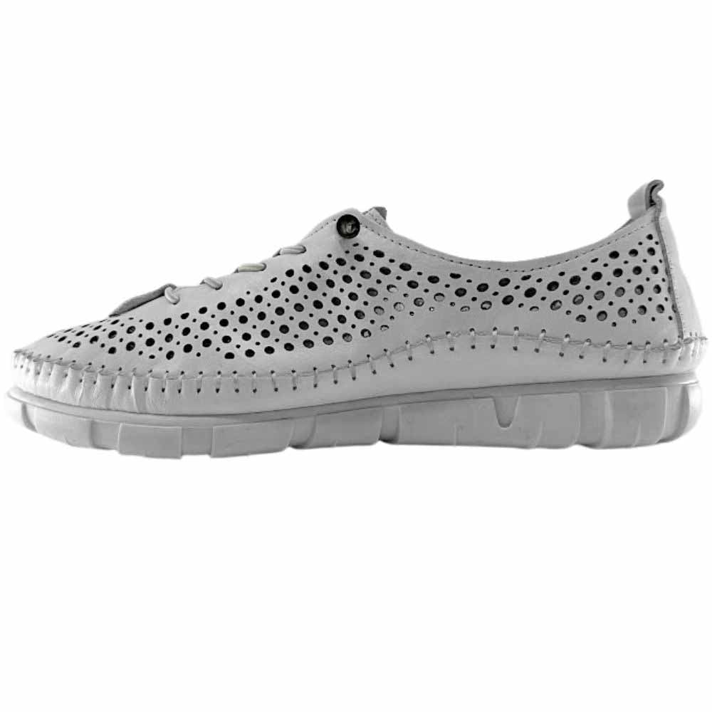 A white perforated Turkish leather sneaker with bungee laces and a white sole, shown against a white background.