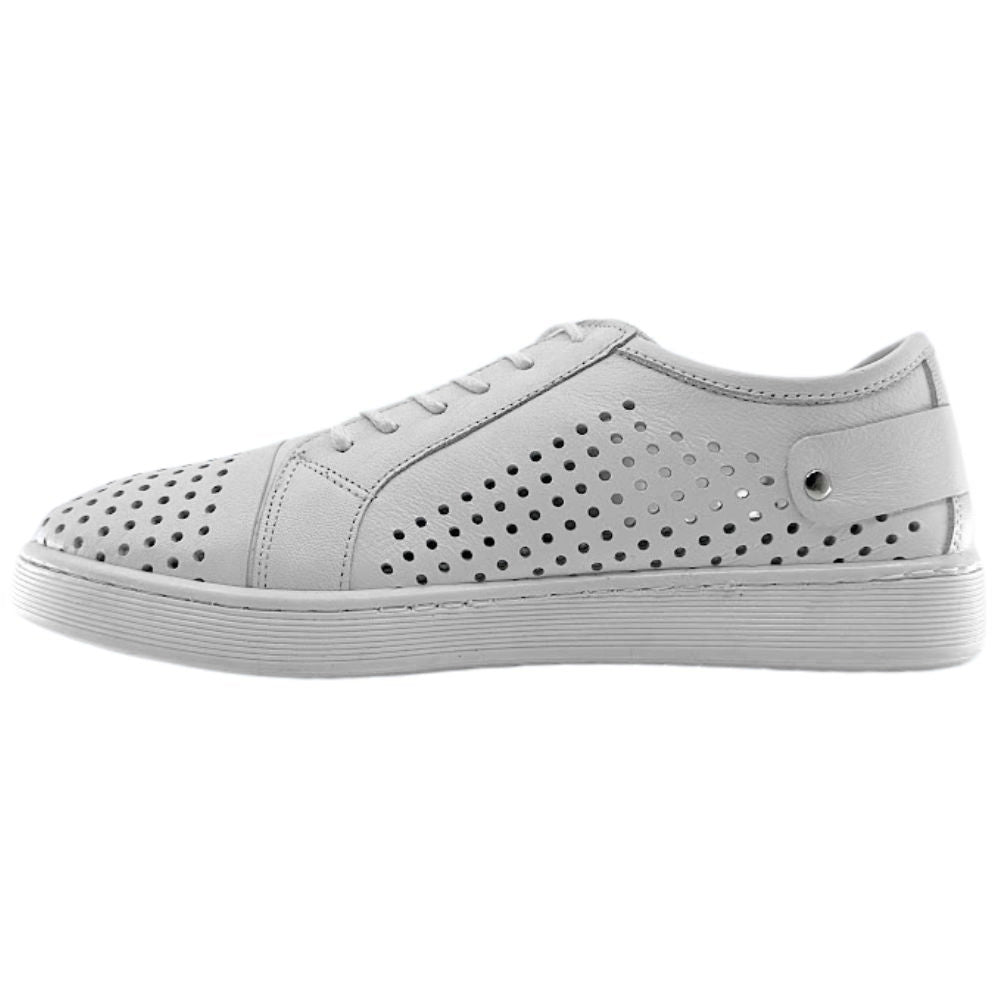 The inside view of a single white sneaker with a perforated Turkish leather upper, against a white background.
