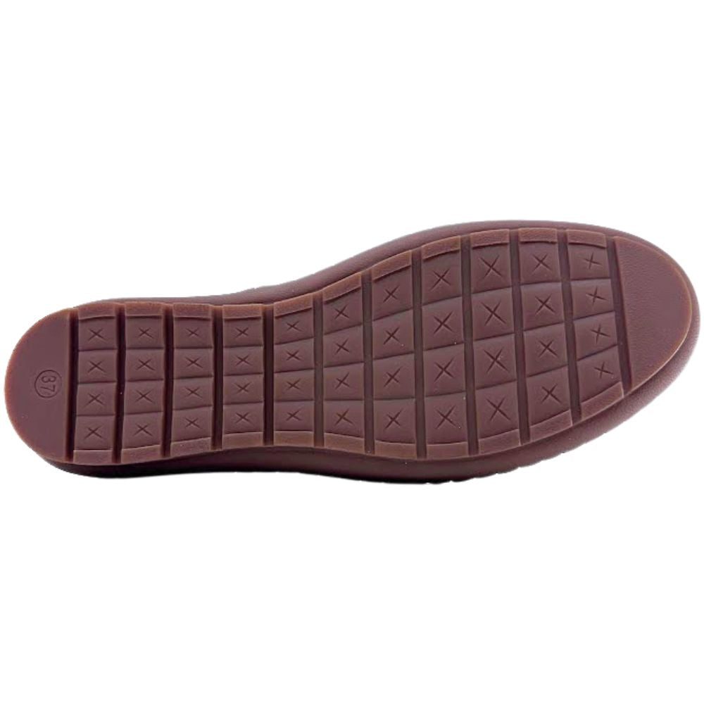 Brown shoe sole with tread pattern on a white background
