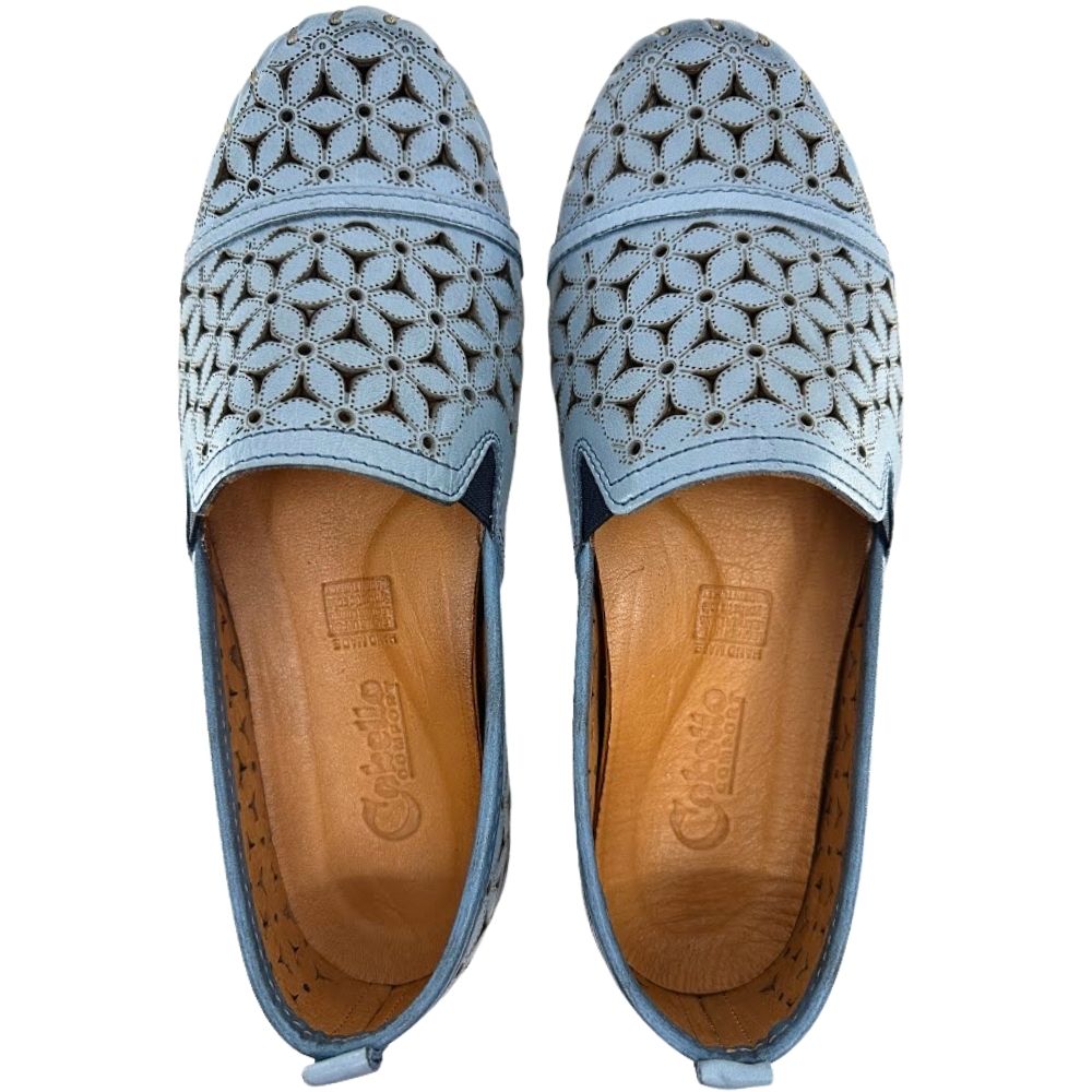 A pair of denim blue laser-cut Cabello leather loafers with elastic gussets, shown from a top-down perspective against a white background.