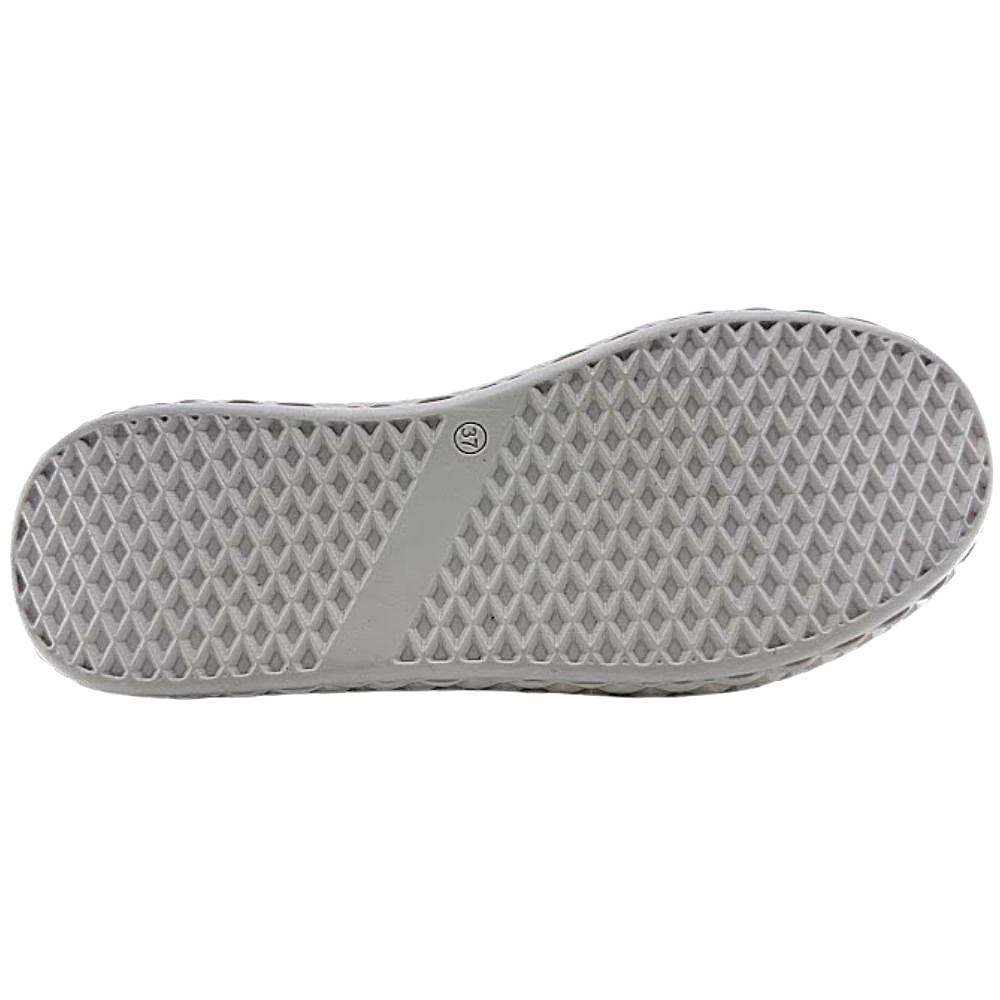 Beige shoe sole with textured pattern on a white background