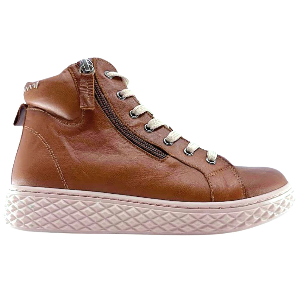 Tan leather ankle boot with a white sole on a white background