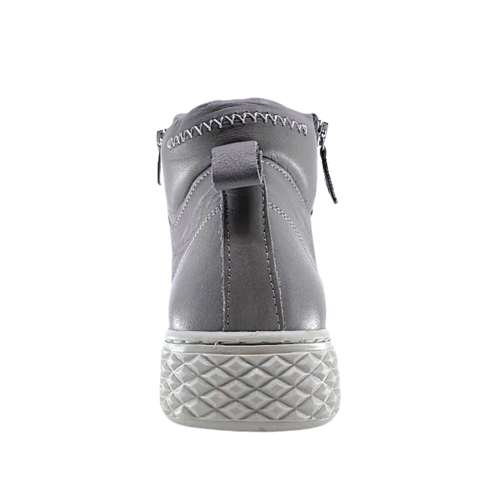 Taupe leather ankle boot with a textured sole on a white background
