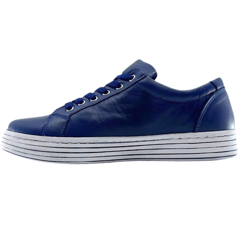 Navy sneaker with white sole on a white background