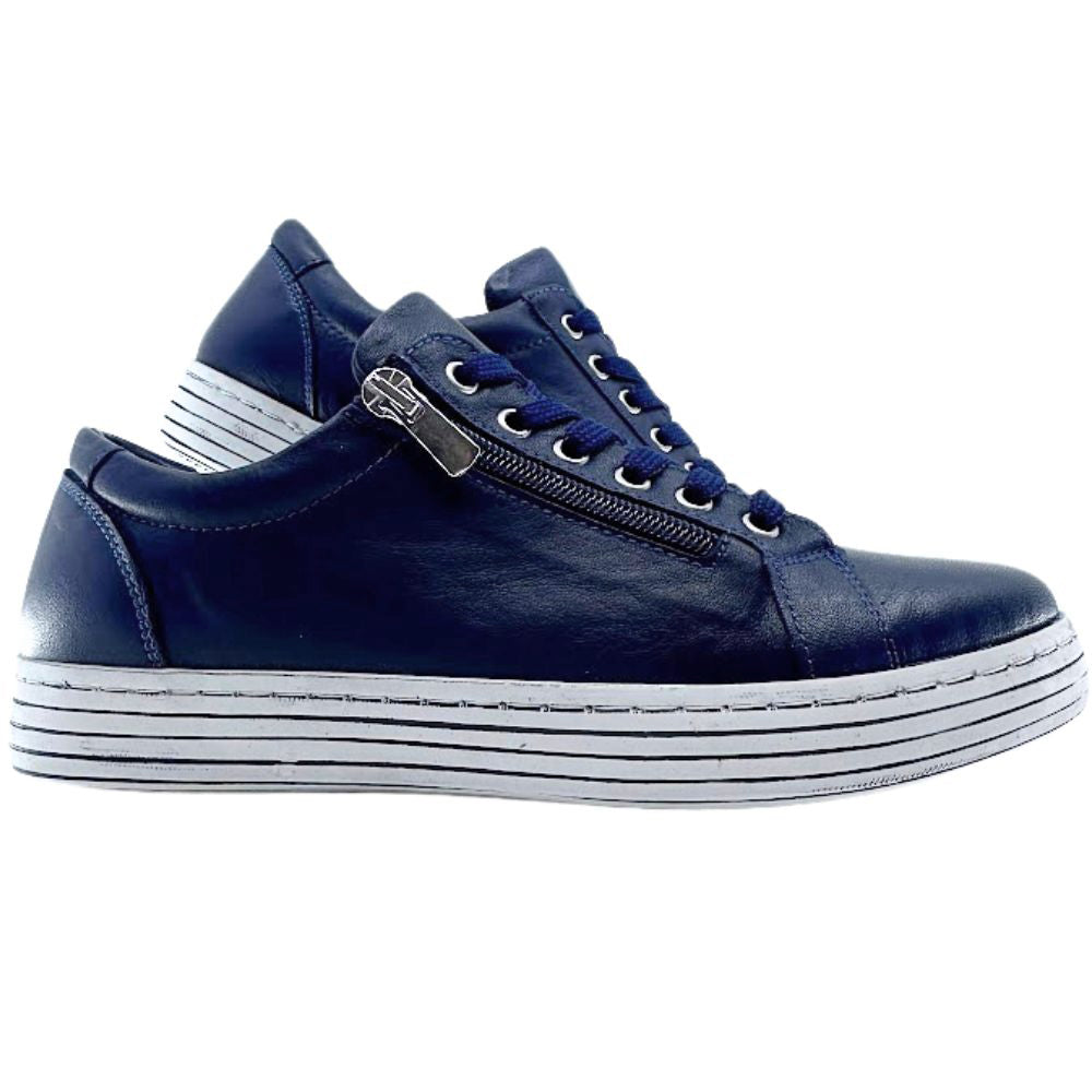 Navy blue sneakers with a white sole on a white background