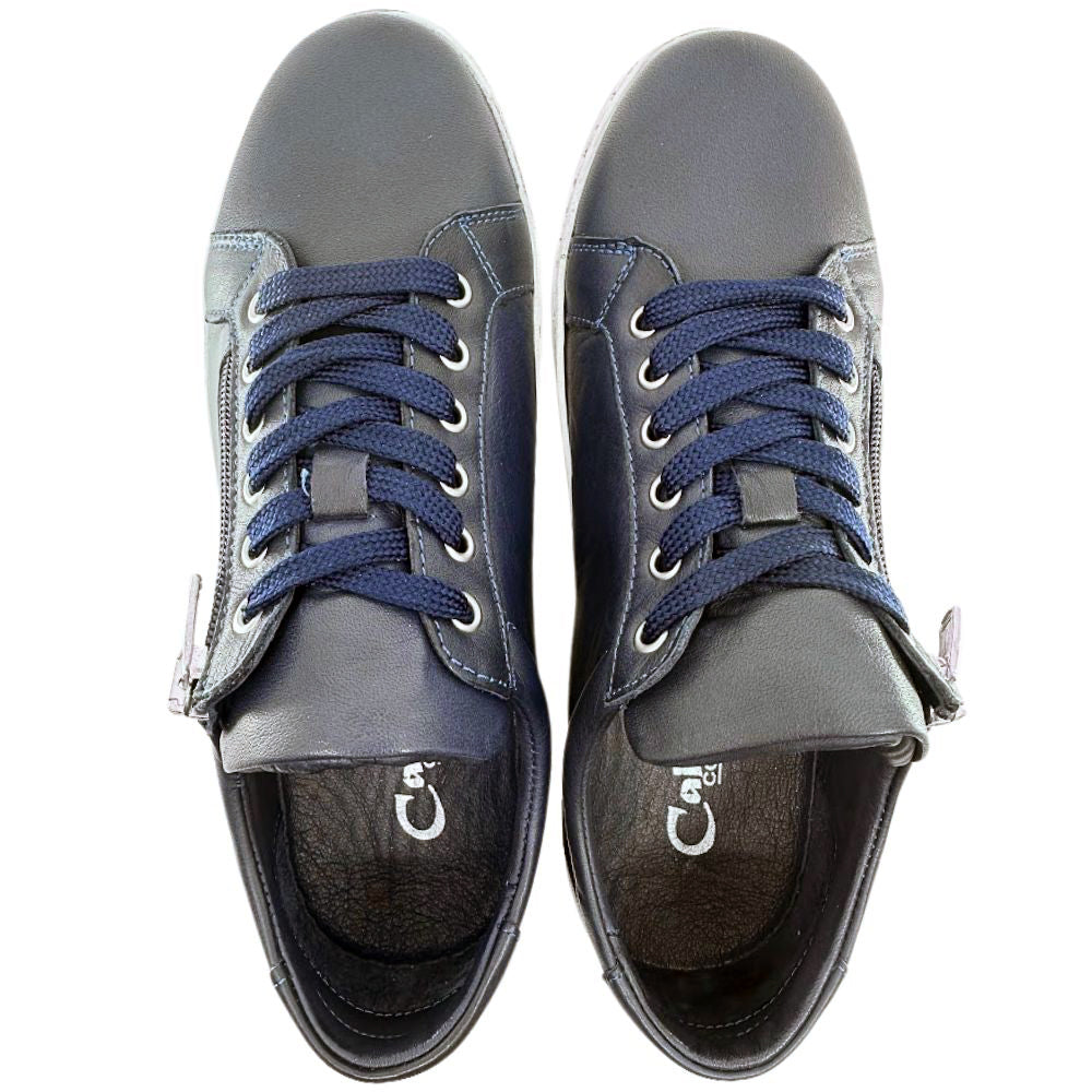 Pair of navy blue sneakers with blue laces on a white background