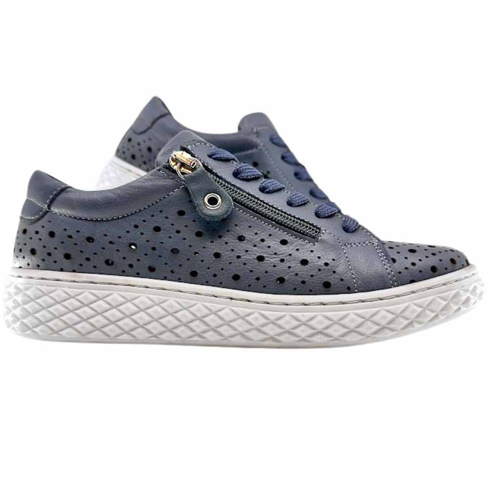 A pair of women's low-top sneakers in denim blue leather with perforated details, featuring a side zipper, matching denim laces, and a thick white textured sole.