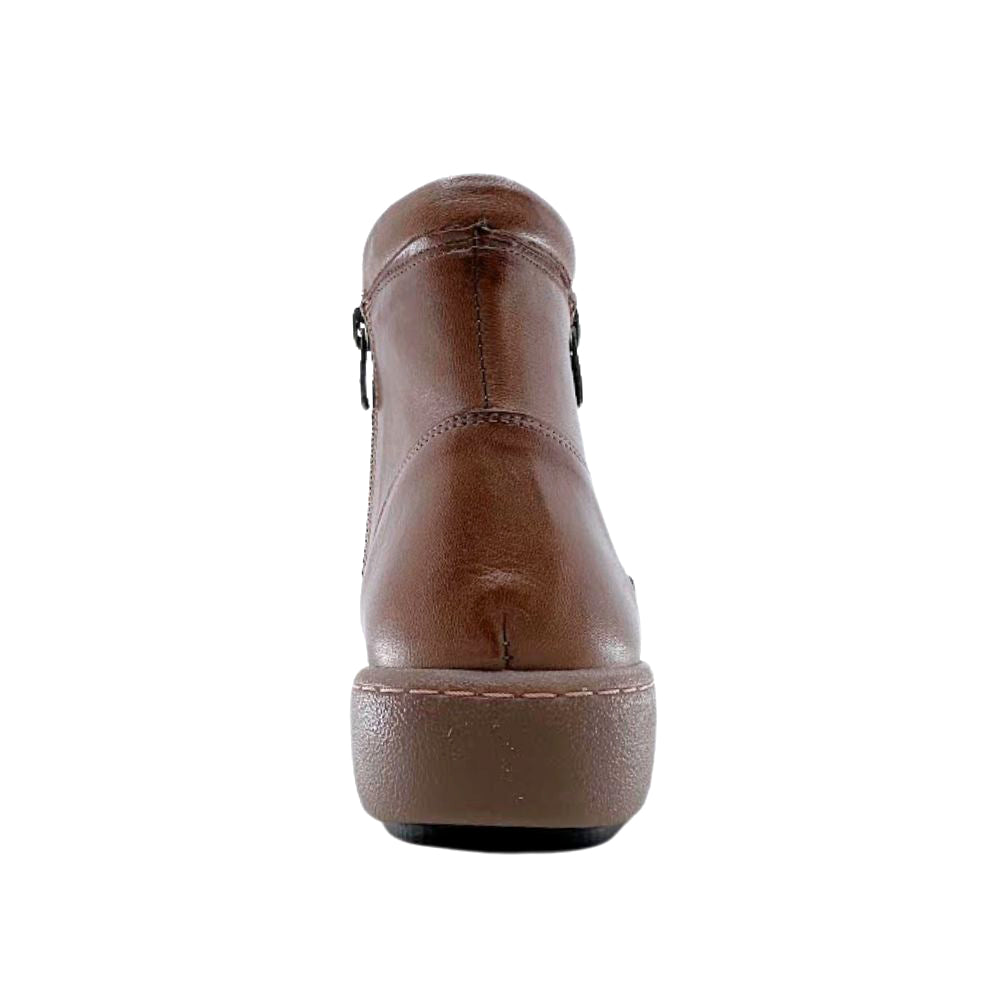 Brown leather boot on a white background