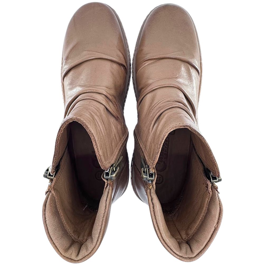 Pair of brown leather boots on a white background