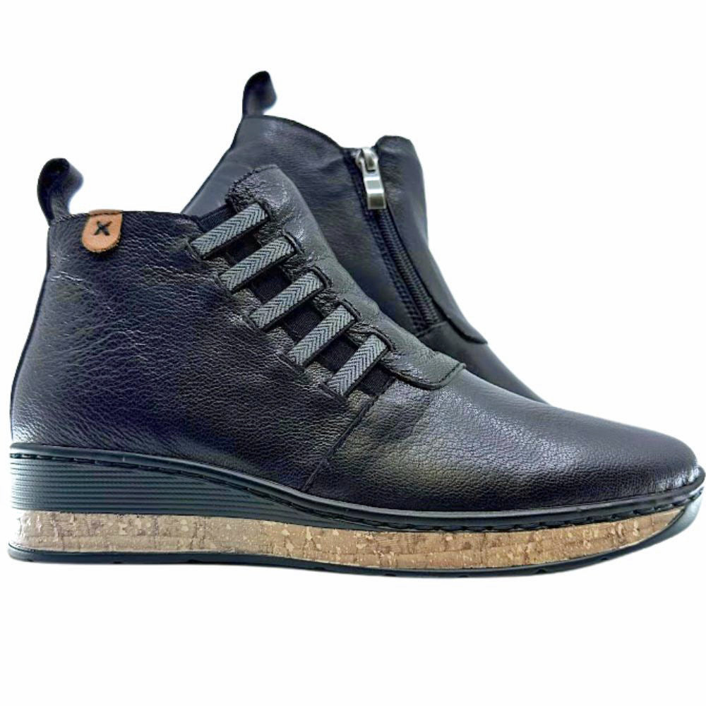 Black leather boots with a cork sole on a white background