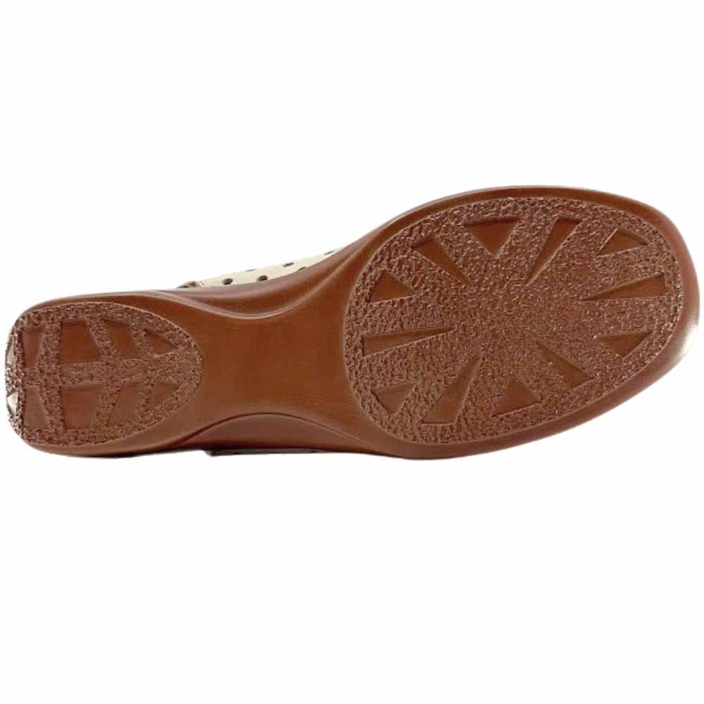 The brown rubber outsole of a slip-on shoe showing a tread pattern, against a white background.