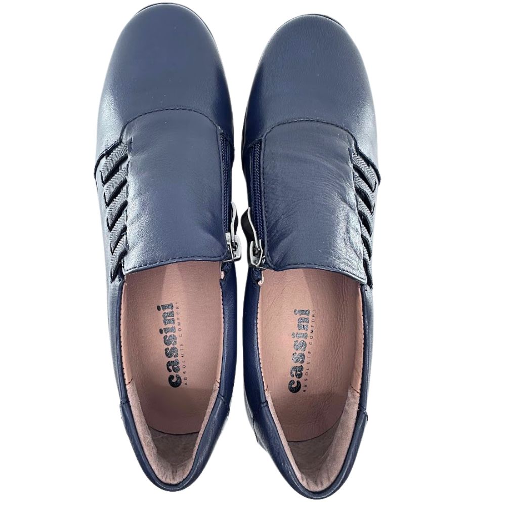 Pair of navy loafers with 'cassini' branding on a white background