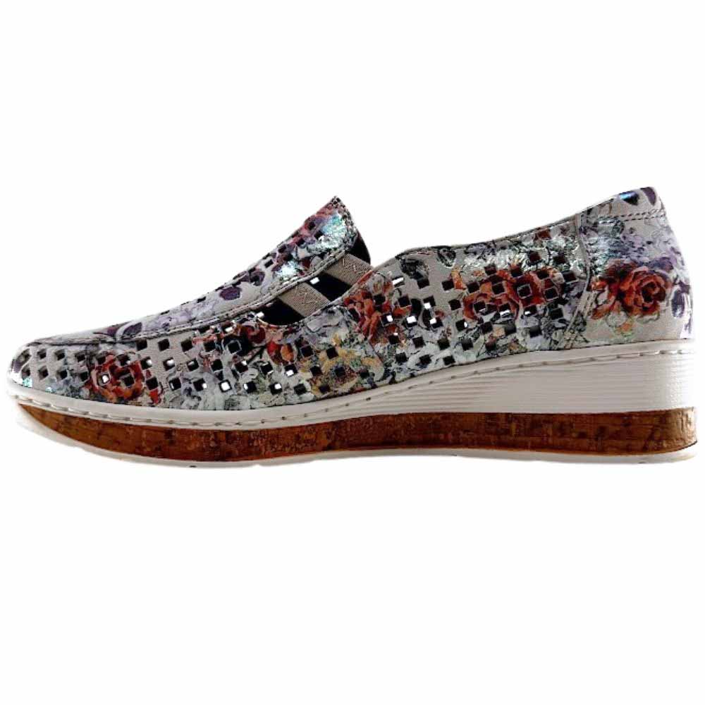 A women's slip-on wedge shoe featuring a metallic multicolor floral-patterned upper with a textured perforated design, a cork-look midsole, and a white stitched edge.