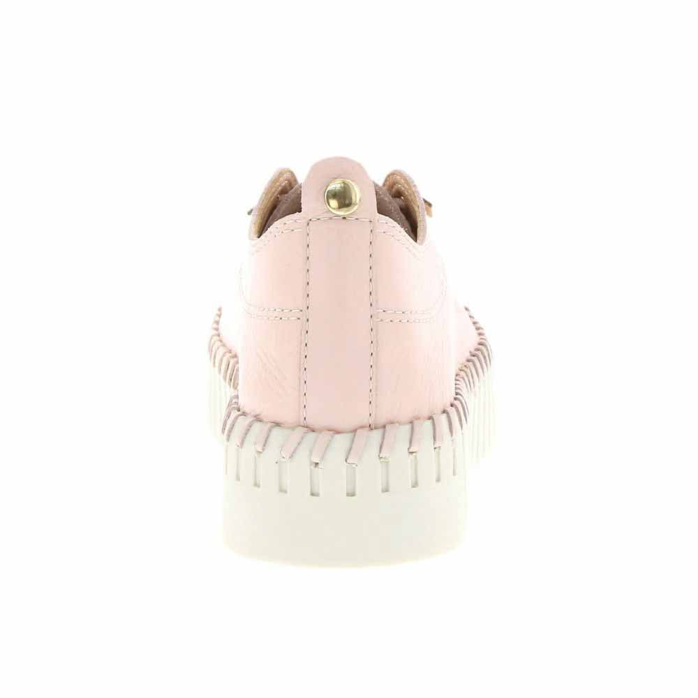 A light pink leather platform sneaker shown from the back, featuring a thick off-white platform sole with a decorative small gold metal accent on the heel.