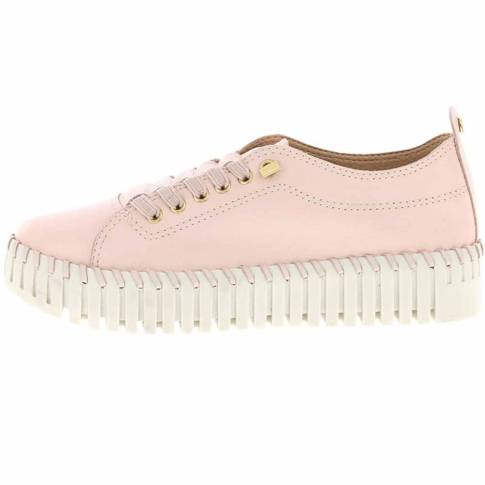 A light pink leather low-top sneaker with matching pink laces, gold-tone eyelets, and a chunky off-white ridged platform sole, shown in a side profile on a white background.