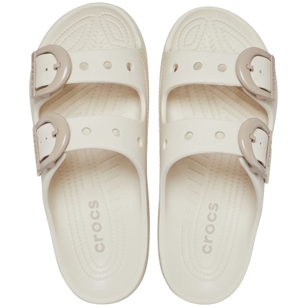 A pair of Crocs double-strap slide sandals in cream/off-white, shown from a top-down view on a plain white background.