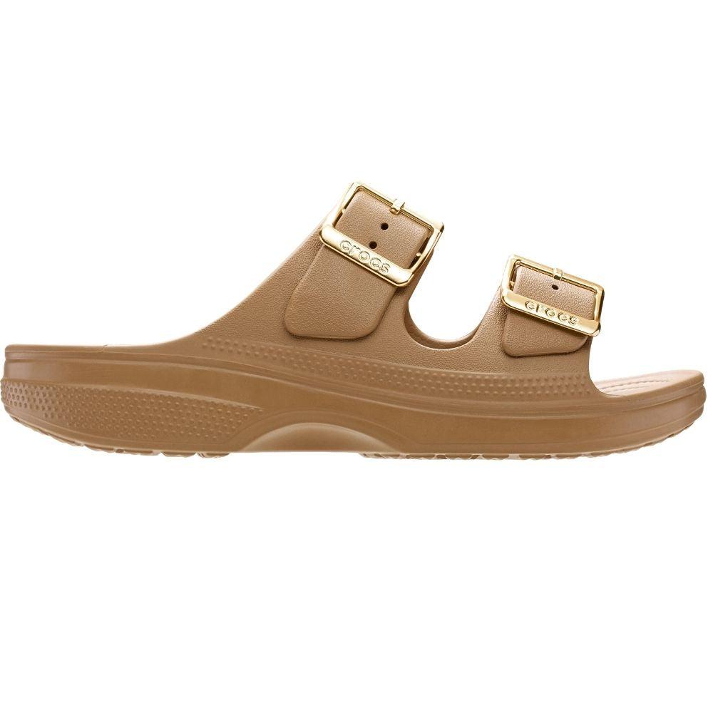 A single tan double-strap 'Crocs' slide sandal with gold-tone buckle details, shown in a side profile on a white background.
