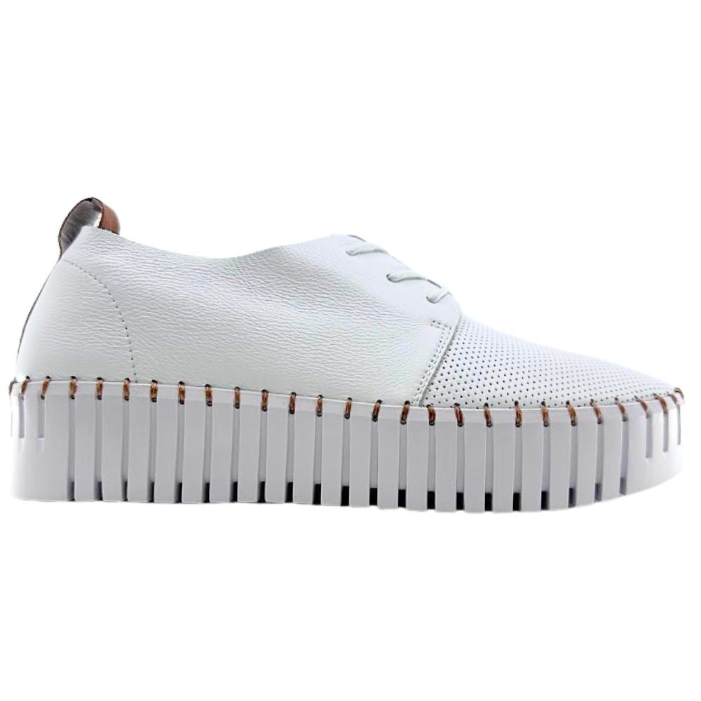 White sneaker with tan accents and a cleated sole on a white background