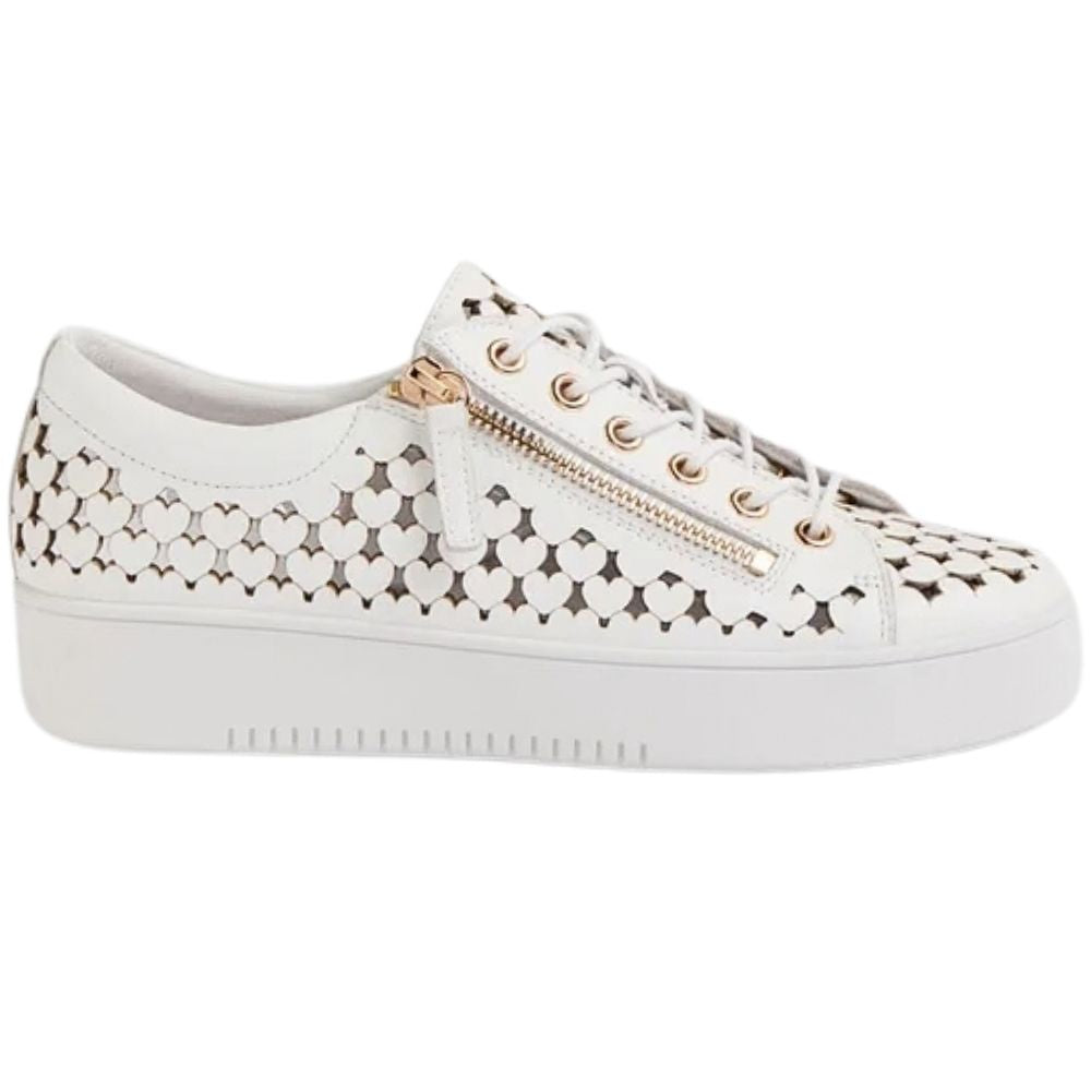 A white leather low-top sneaker with a heart-shaped cutout pattern on the sides, featuring a gold-tone zipper, gold eyelets, and white laces on a plain white background.