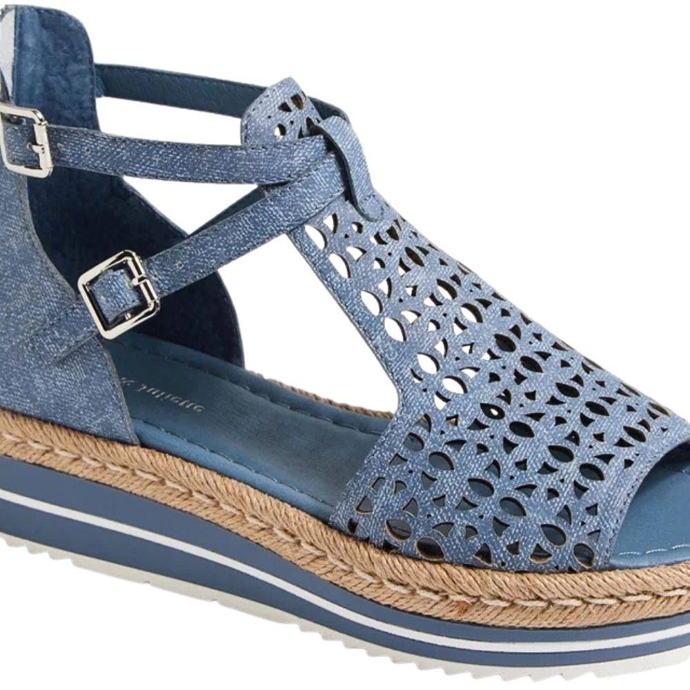 A single women's wedge sandal in a dusty blue denim leather, featuring a cutout pattern on the toe strap, adjustable ankle straps with silver buckles, and a braided jute platform sole with a denim blue outsole.