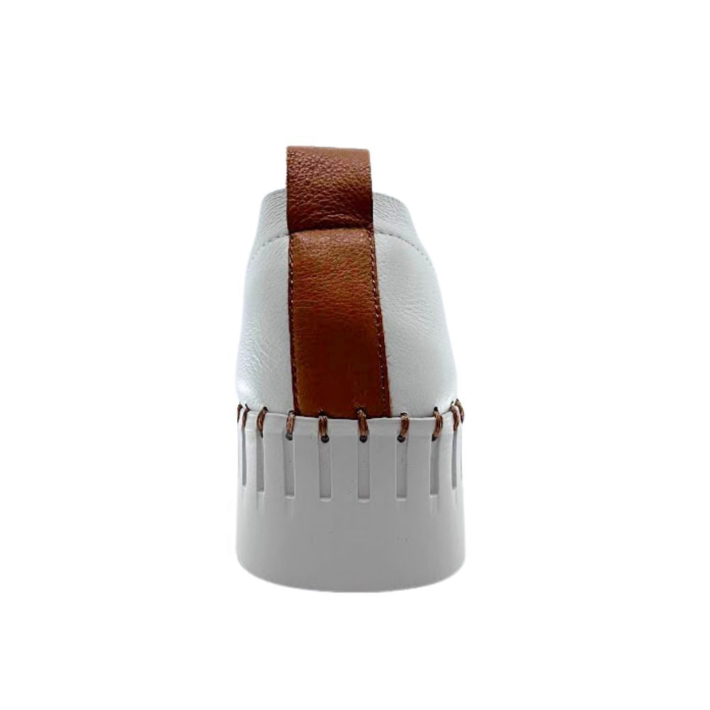 Back of white sneaker with tan pull tab and cleated sole on a white background