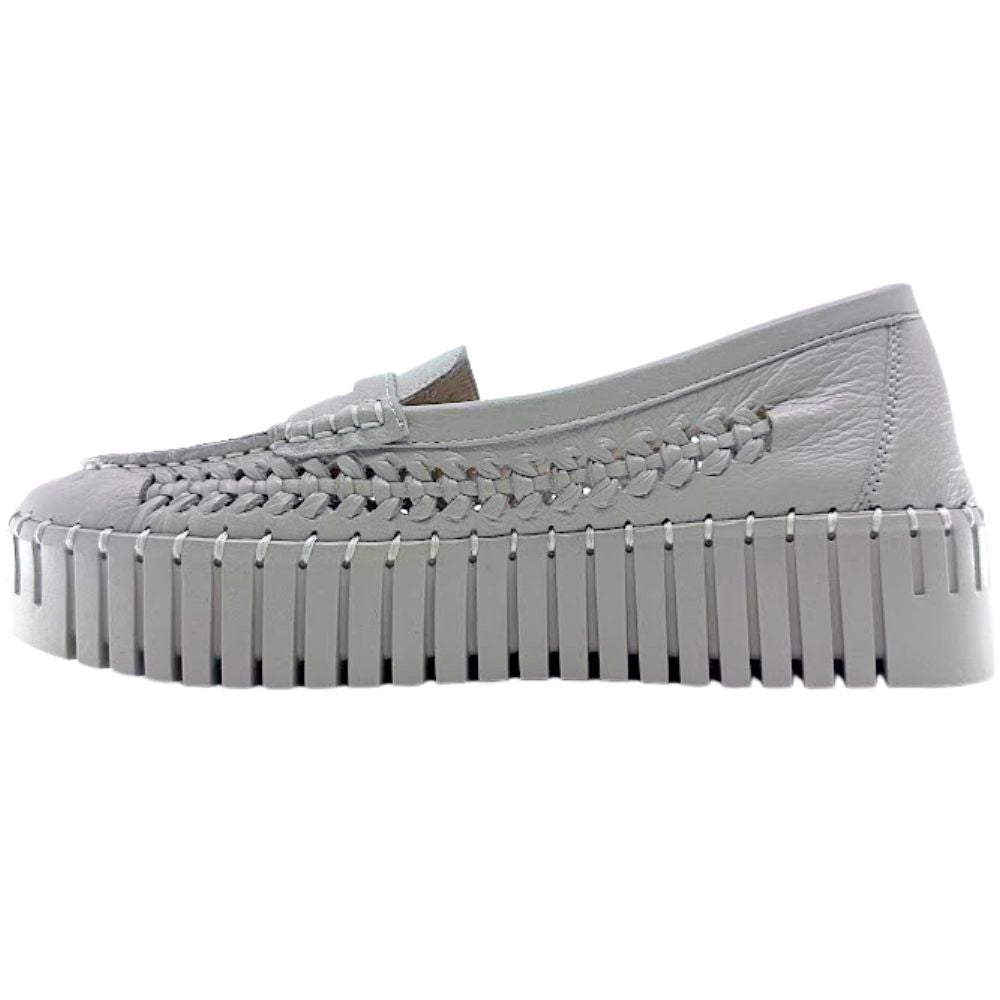 Beige woven leather loafer with a thick sole on a white background