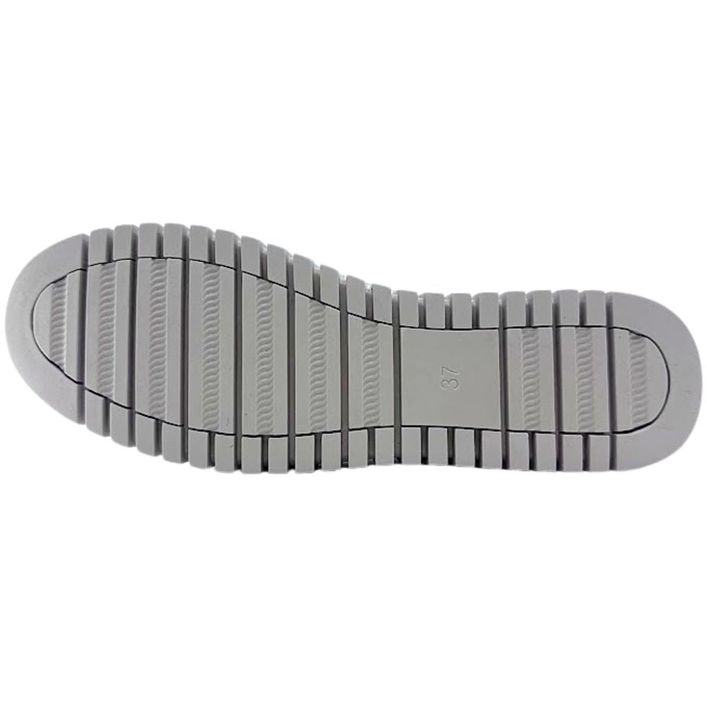 Beige shoe sole with tread pattern on a white background