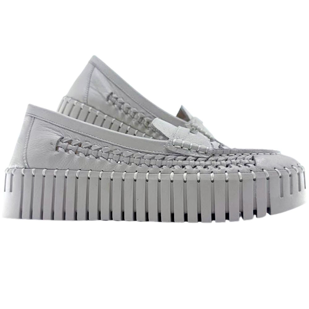 Beige woven leather loafer with a thick sole on a white background