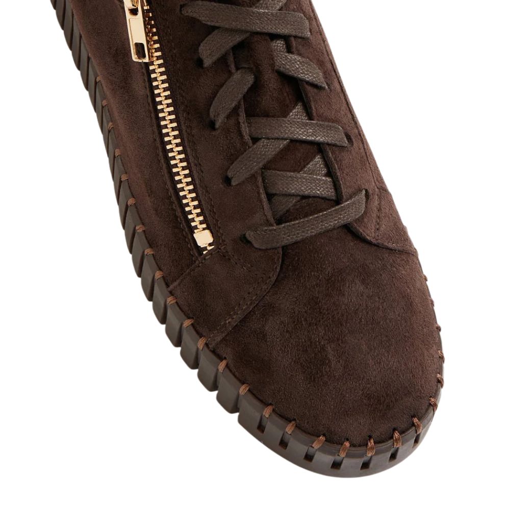 Brown suede sneaker with gold zipper on a white background