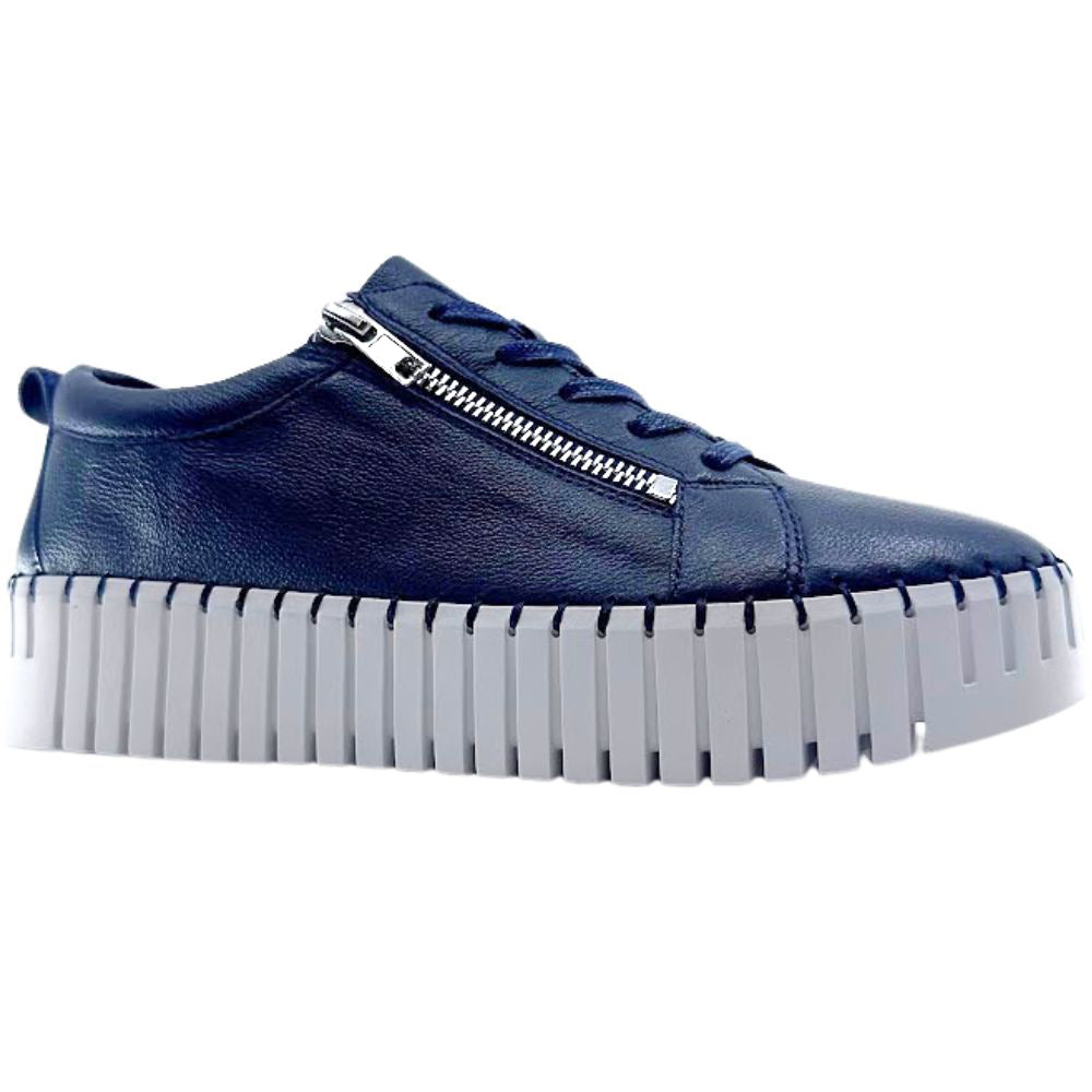 Navy sneaker with a thick sole on a white background