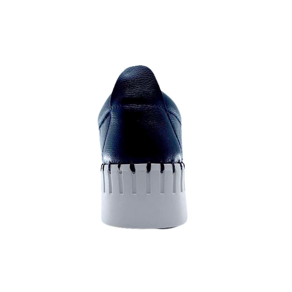 Navy blue shoe with a white sole on a white background