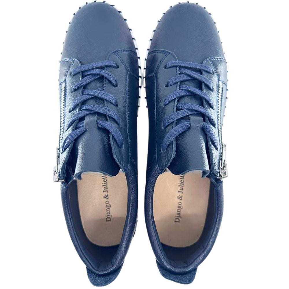 Pair of navy sneakers with visible brand name on a white background