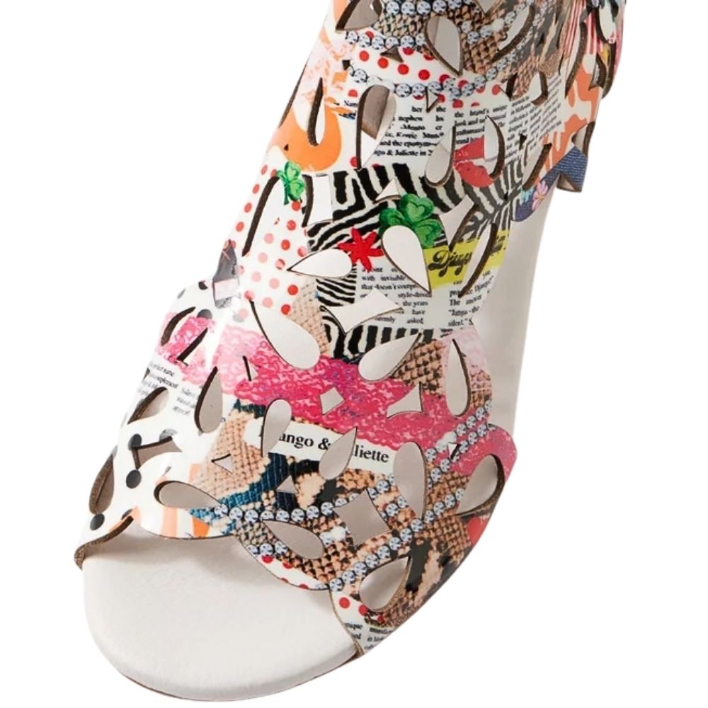 A close-up of a peep-toe sandal featuring a vibrant, multicolor collage print with zebra stripes, leopard spots, pink polka dots, and text patterns on a white sole.