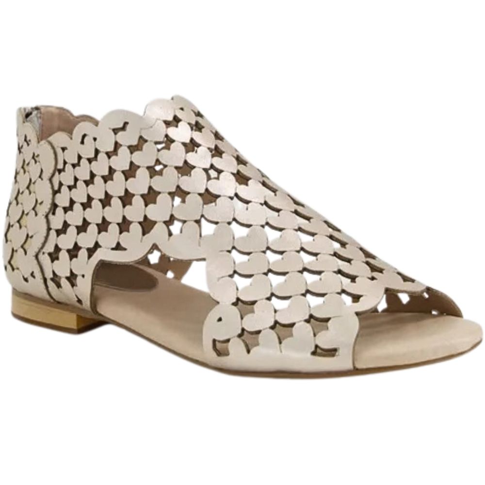 A single flat sandal with a metallic champagne-gold upper featuring a heart-shaped cutout pattern and a scalloped edge, shown from a side profile on a white background.