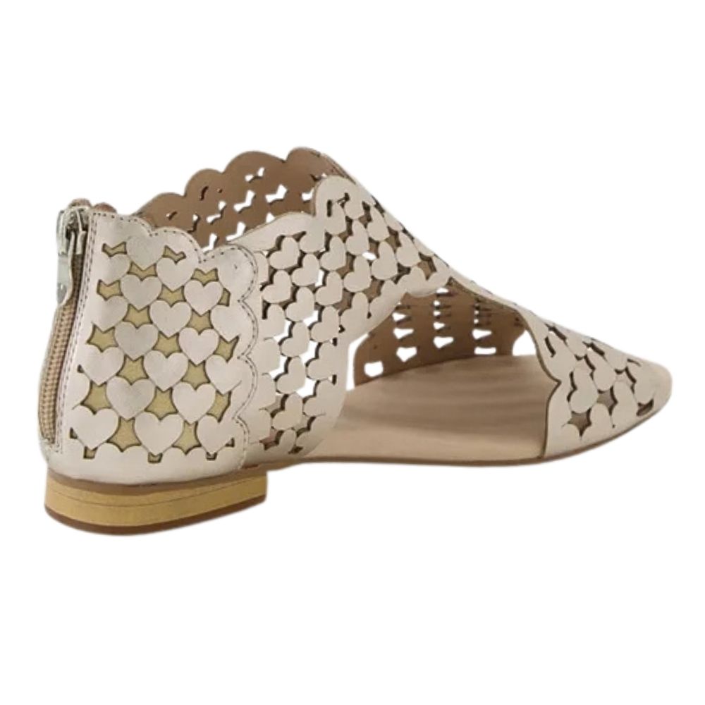A single women's flat sandal shown from a side angle on a white background. The shoe features a scalloped edge, a rear zipper, and a cutout upper pattern of hearts in a champagne gold leather, with a beige insole.
