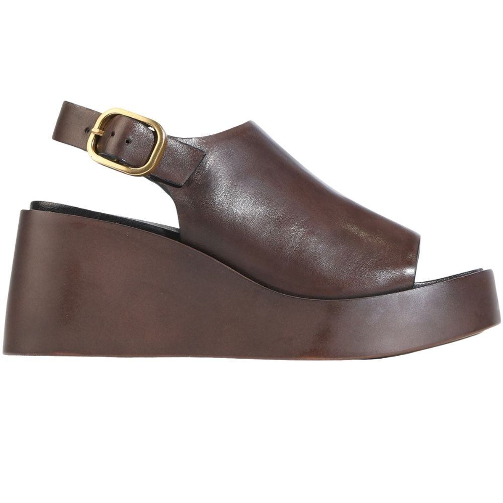 A dark brown leather platform sandal with an ankle strap and a gold-tone buckle, shown from a side profile view on a white background.