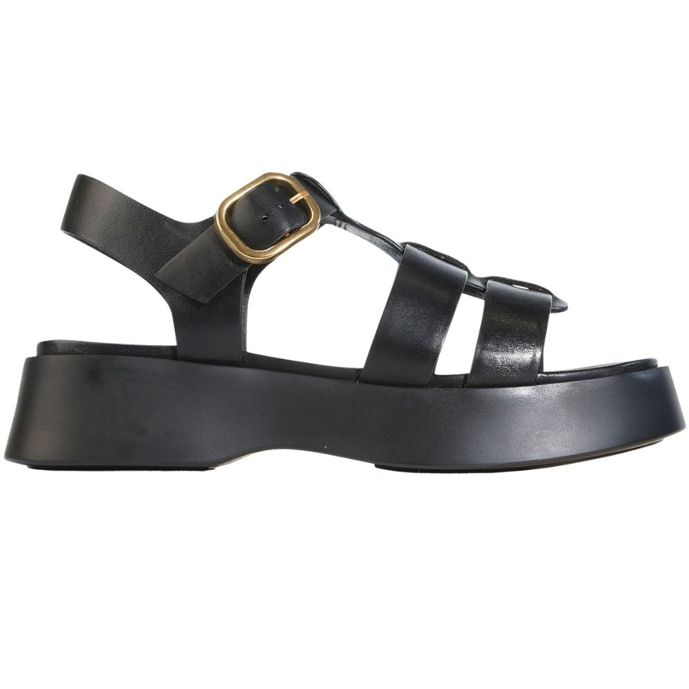 A black leather platform sandal with a chunky sole, double front straps, and a gold-tone buckle detail on the ankle strap, shown in a side profile view against a white background.