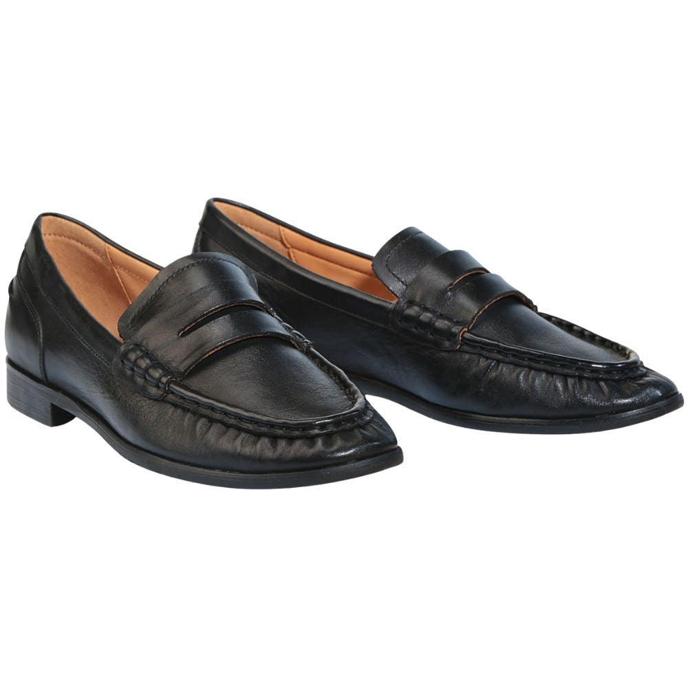 Pair of black leather loafers on a white background