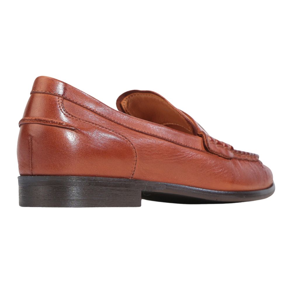 Brown leather loafers on a white background
