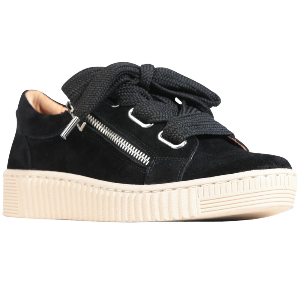 Black suede sneaker with oversized black laces and a zipper on a white background