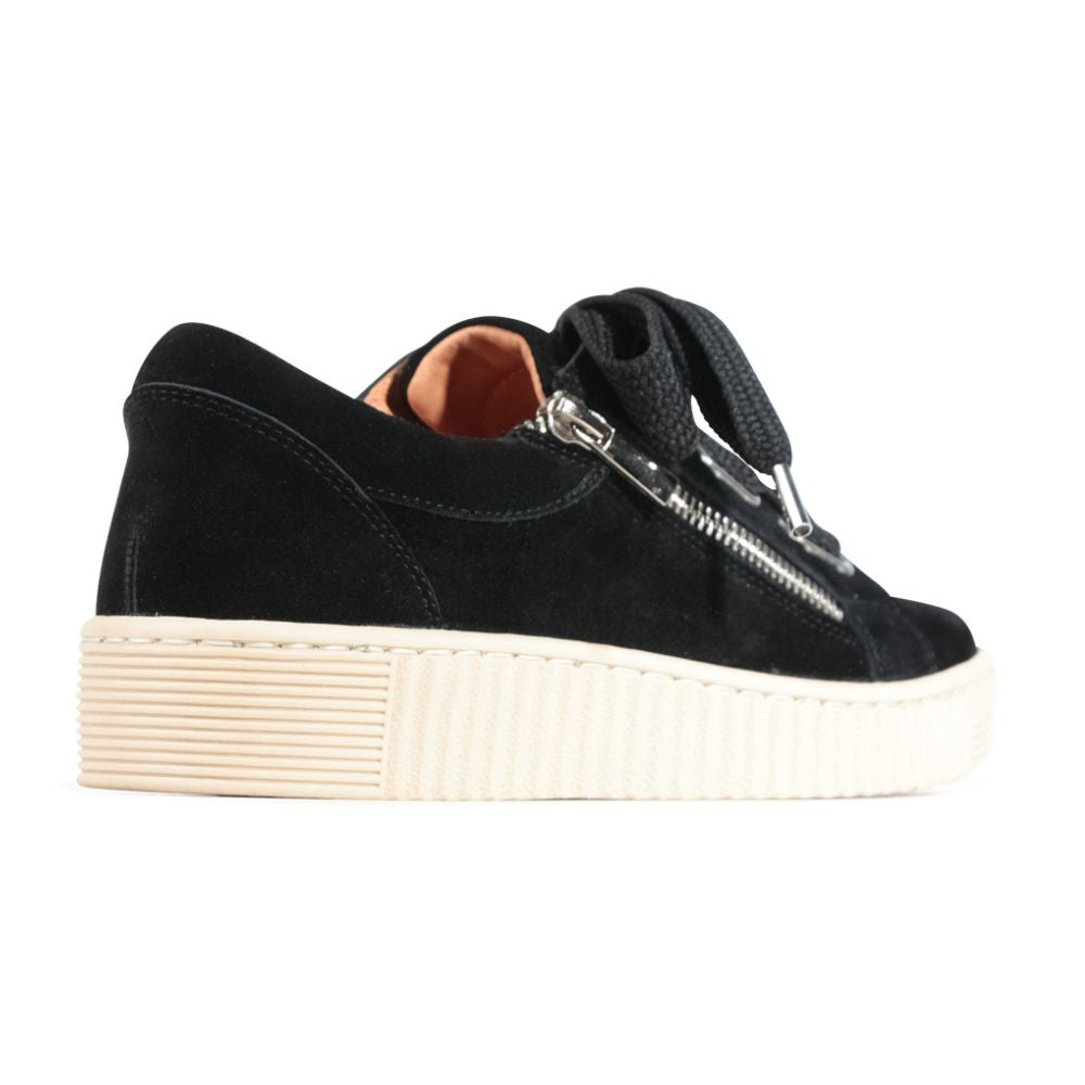 Black suede sneaker with oversized black laces and a zipper on a white background